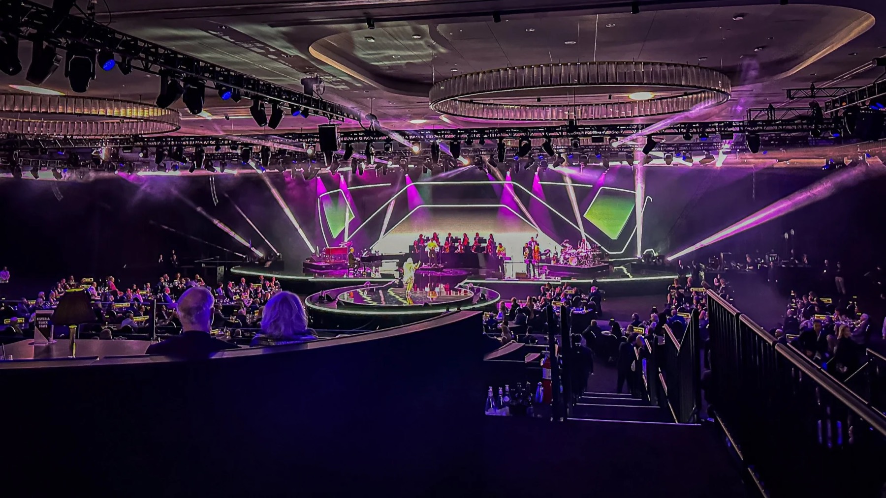 Awards show in the round with purple beams