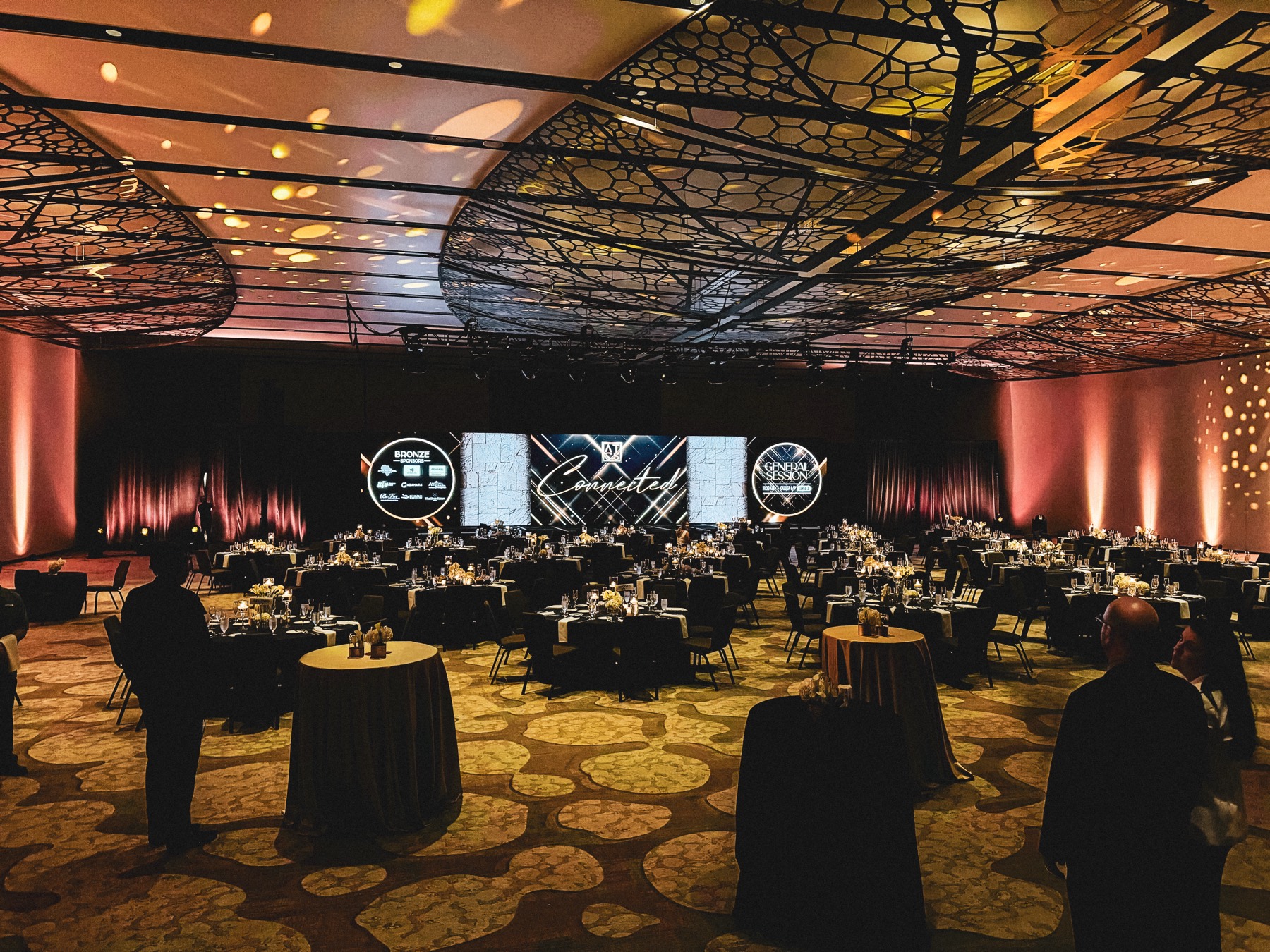 Elegant ballroom production with red uplighting