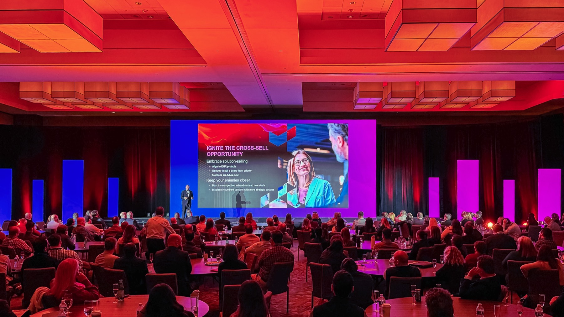 General session with glowing red ceiling and LED columns