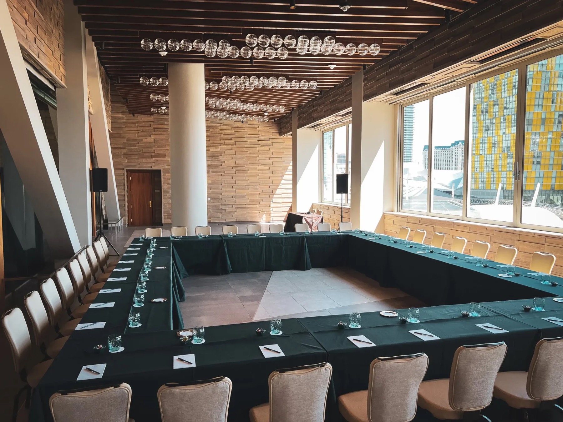 Executive boardroom setup with skyline views