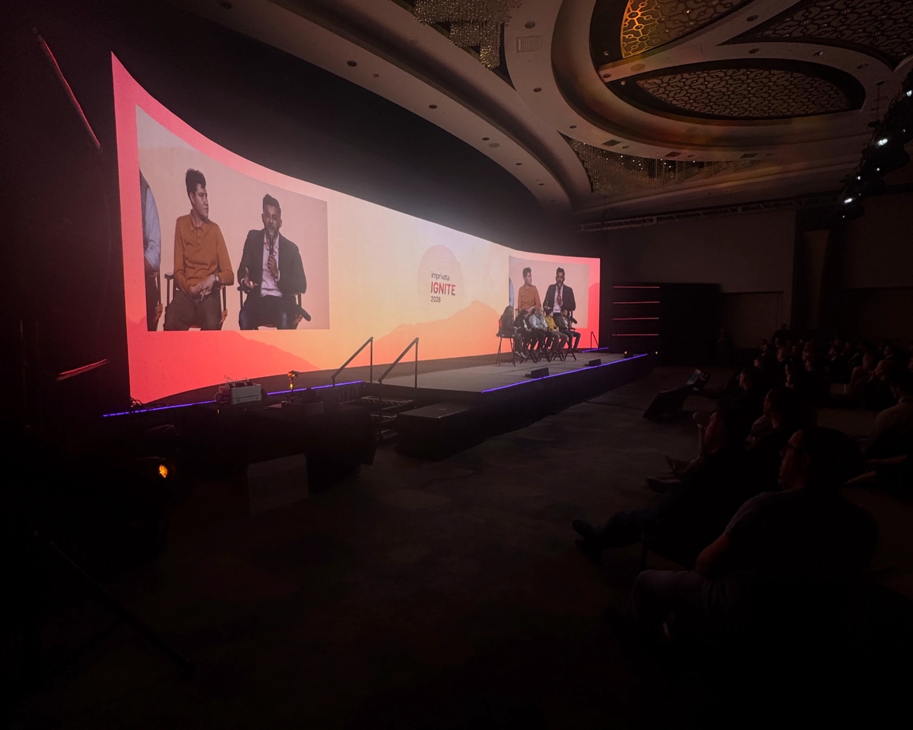 Panel discussion on a curved wall-to-wall LED screen